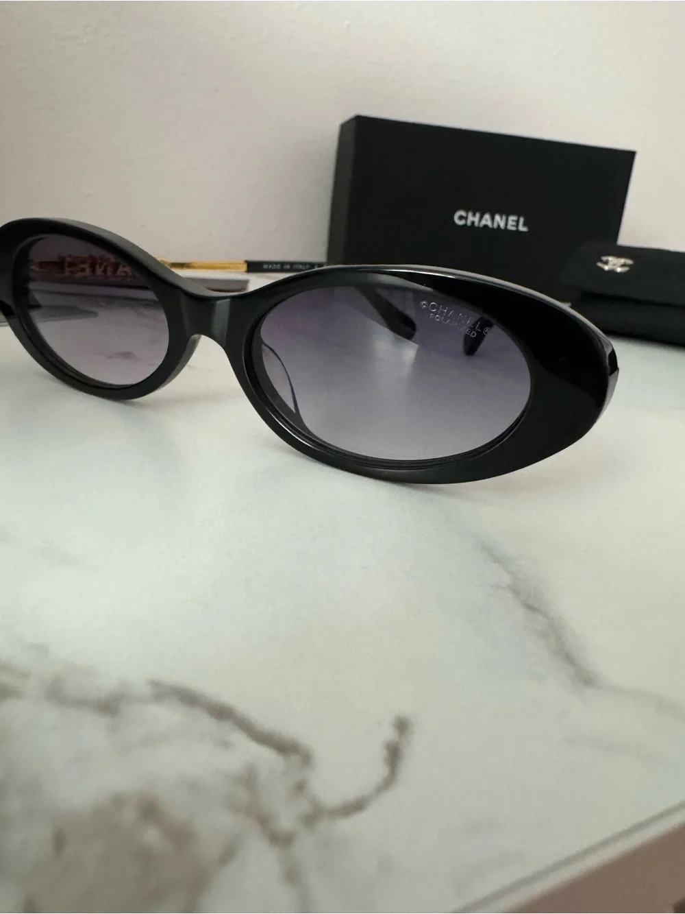 CHANEL Black Oval Sunglasses with Gray Gradient Lenses